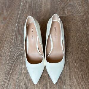 Call it Spring white heels